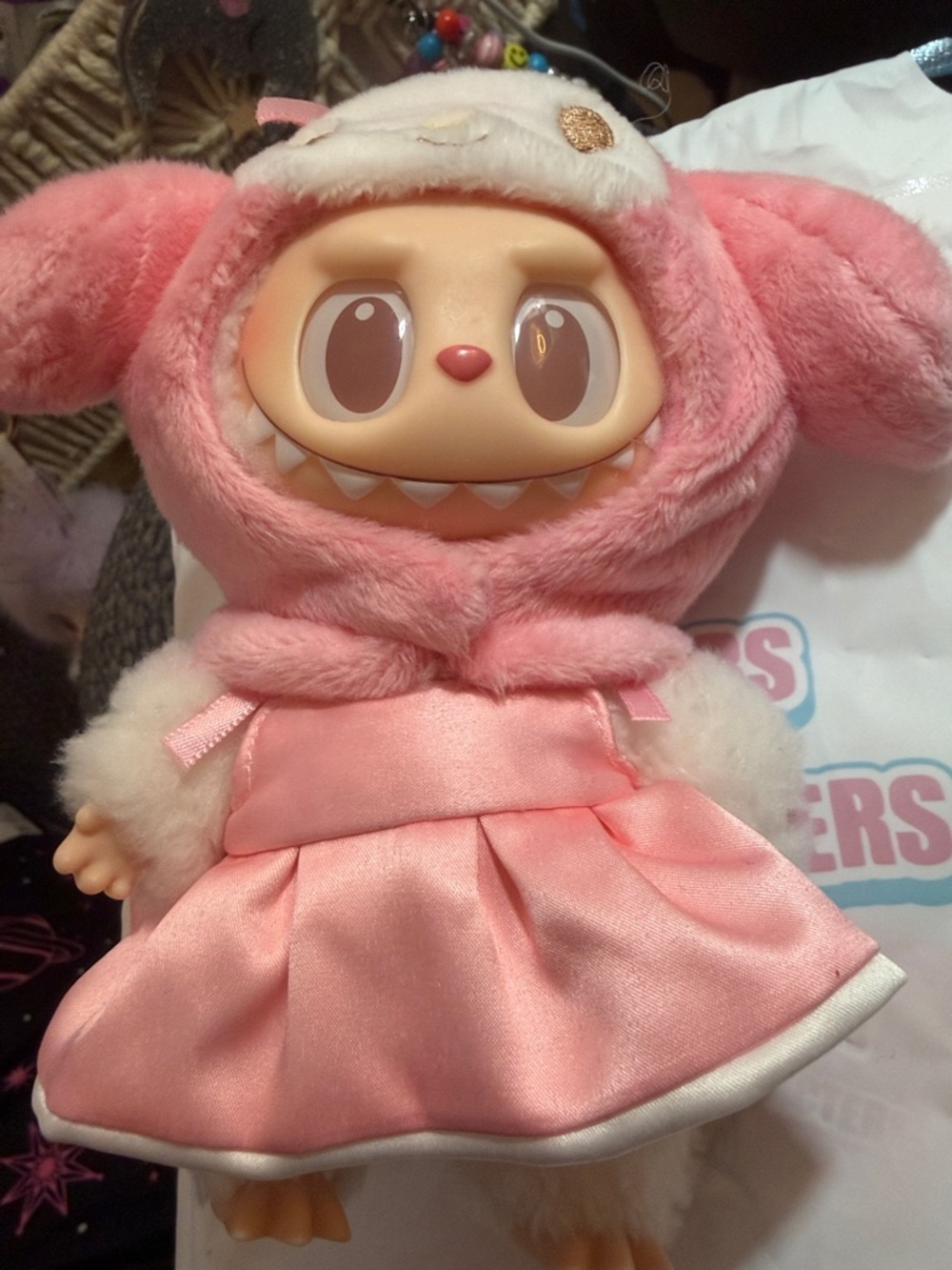 The Monsters x Sanrio Characters" plush doll featuring the Labubu as My Melody